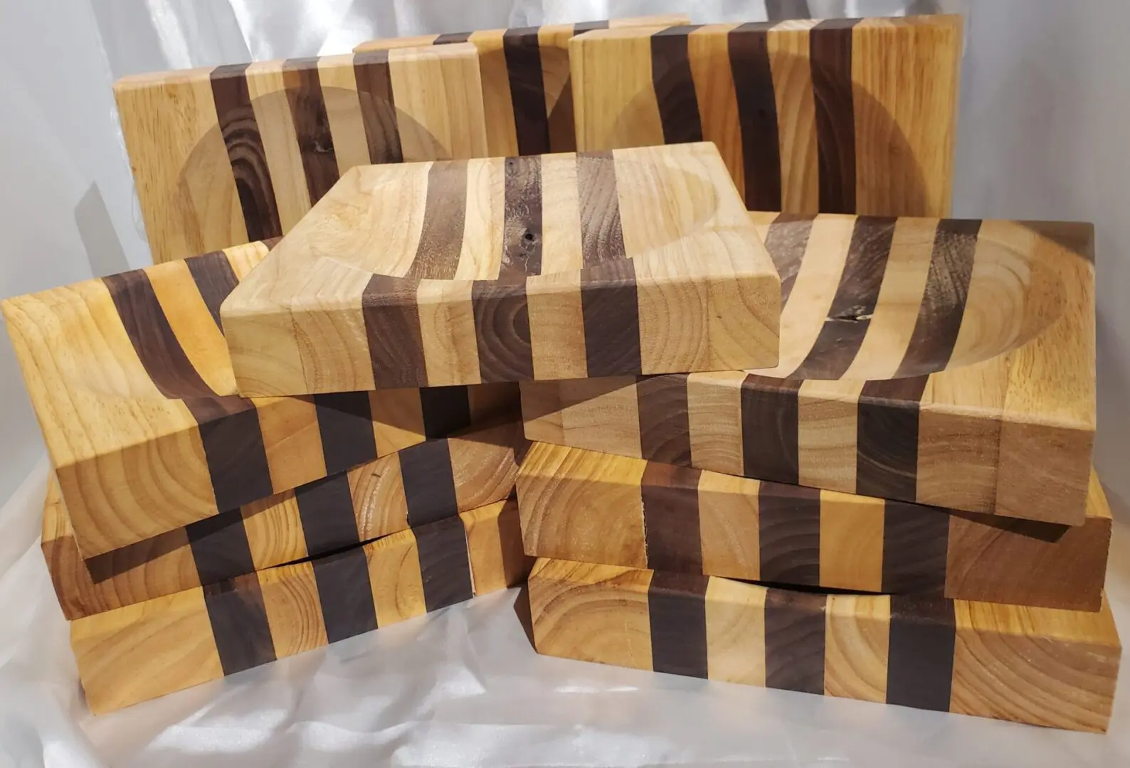 A pile of wooden blocks with black stripes on them.