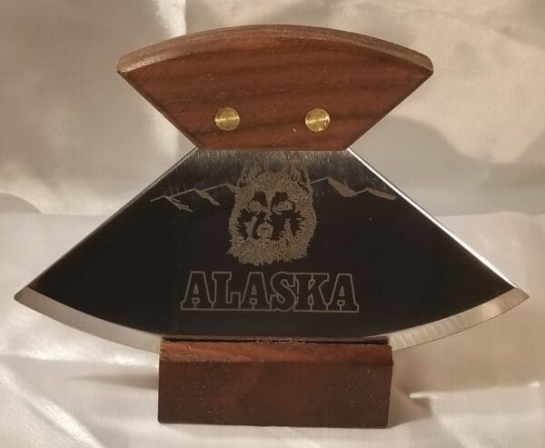 A knife with the word 6" Alaskana Ulu's on it.
