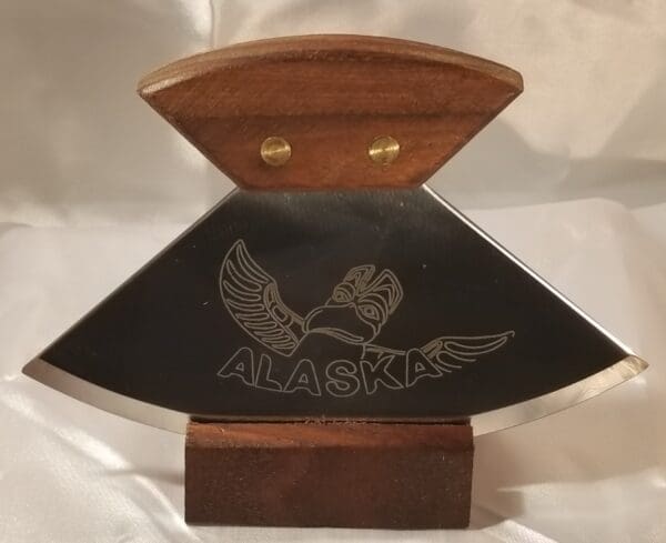 A 6" Alaskana Ulu's - More plaque with the word alaska on it.