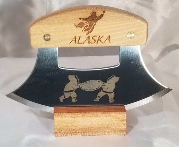 A knife from the Inupiat Heritage Collection with the word alaska on it.