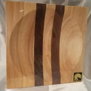 A wooden plate with three strips of wood on it.
