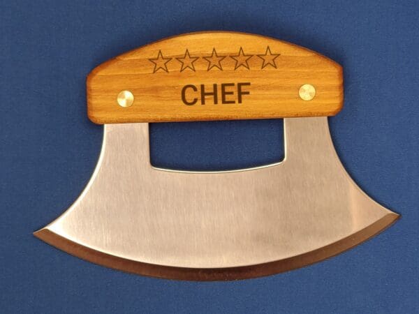 A chef 's knife with the word " chef " on it.