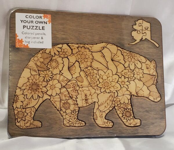 A wooden puzzle with a bear design on it.