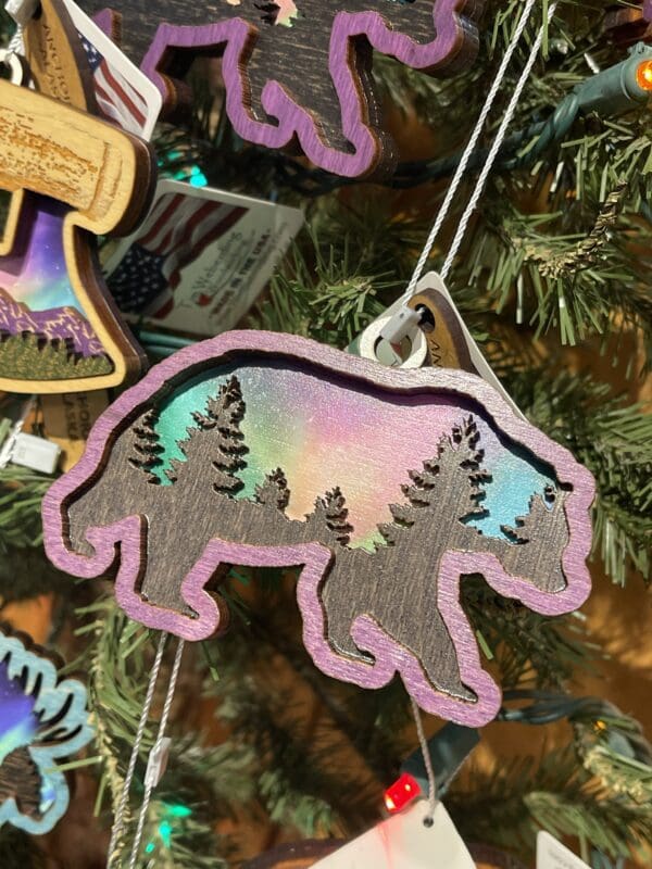 Bear ornaments hanging on a tree.