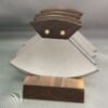 Stylish metallic awards with wooden bases.